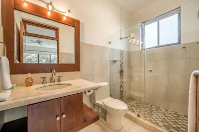 a bathroom with a sink toilet and a shower at Casa Carmen in Potrero