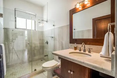 a bathroom with a sink and a glass shower at Casa Carmen in Potrero