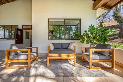 two chairs and a table in a living room at Casa Carmen in Potrero