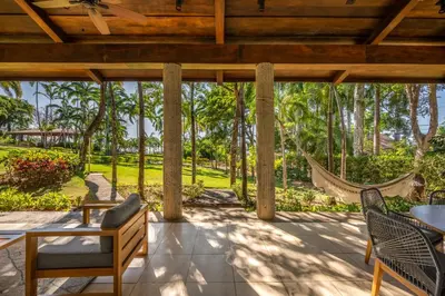 an outdoor patio with a hammock and a hammock swing at Casa Carmen in Potrero