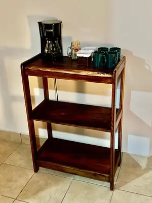 a wooden shelf with cups and a blender on it at daBene - Bed & Breakfast in Alajuela City