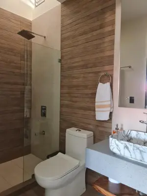 a bathroom with a toilet and a shower and a sink at Cute Escazú Loft -Great view- in Escazu
