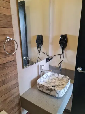 a bathroom with a sink and a mirror at Cute Escazú Loft -Great view- in Escazu