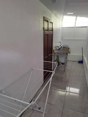a hospital room with a bed and a desk at Tiny house PZ in San Rafael Norte