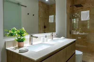 a bathroom with a large sink and a shower at Casa Mapache in Tamarindo