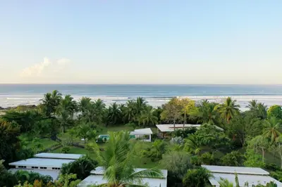 an aerial view of a resort and the ocean at Salvatierra Beachfront Hotel in Puerto Coyote