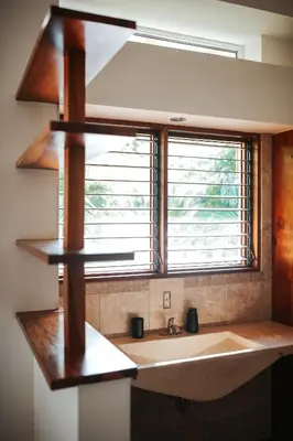 a kitchen with a sink and a large window at Salvatierra Beachfront Hotel in Puerto Coyote