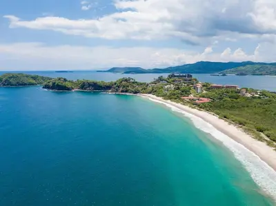 an aerial view of a beach in the ocean at 360 Splendor 104A-Ocean View Condo With Breakfast in Playa Flamingo