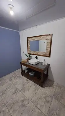 a bathroom with a sink and a mirror at Casa vista de luna in Guaria