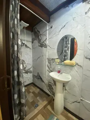 a bathroom with a sink and a mirror at Casa Lupita Alajuela in Alajuela City