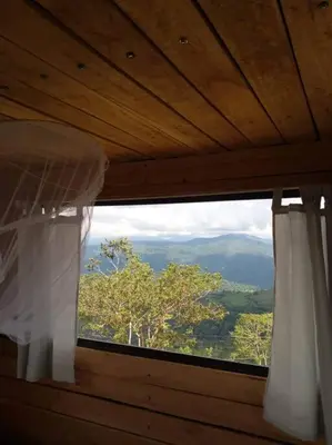 a window with a view of a mountain view at Alto Luciérnaga in Guayacán