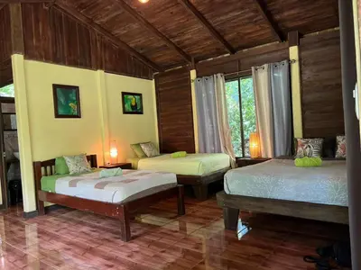 a bedroom with two beds in a room at Casita Lidia Bijagua in Bijagua