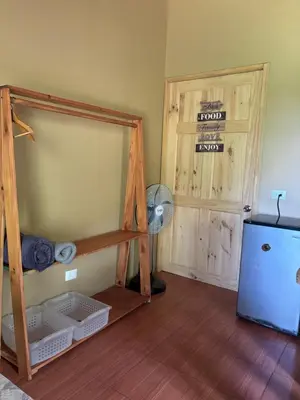 a room with a bunk bed and a fan at OXÍGENO Río Celeste in Bijagua