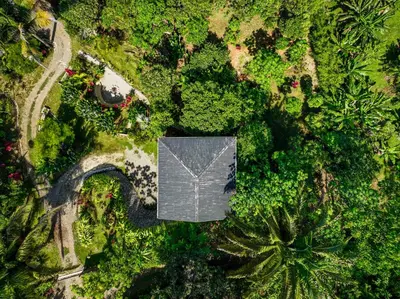 an overhead view of a house in a forest at Private Casita Jungle Treehouse Ocean View in Uvita