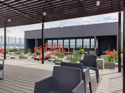 a patio with a red slide on a building at Nucleo 514 in San José