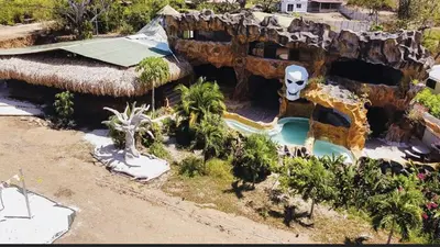 an aerial view of a pool at a theme park at La Perla Negra Eco Pirate Resort in Puntarenas
