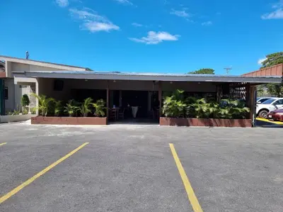 a parking lot in front of a building at Department H González 2 in Alajuela City