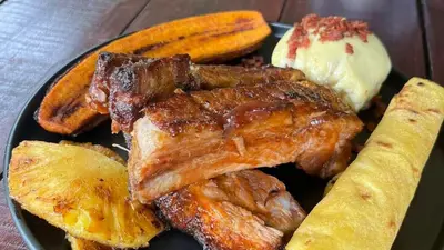a plate of food with meat and bread and ice cream at Casa Esperanza in Río Cuarto