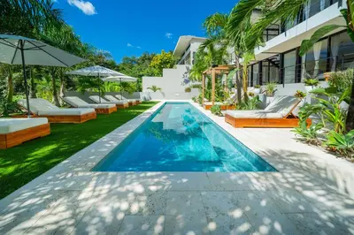 an infinity pool in the backyard of a villa at L'Avventura in Tamarindo