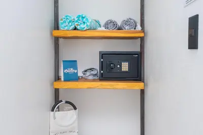 a shelf in a room with a microwave on it at L'Avventura in Tamarindo