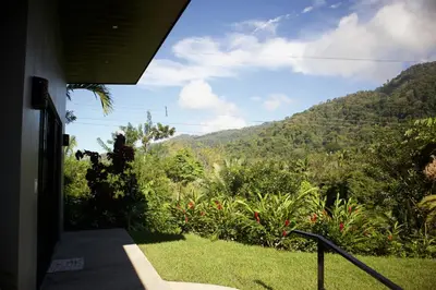 a view of a mountain from the porch of a house at Jungle Home with King Beds -5 Minutes from the Beach in Uvita