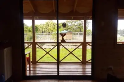 an open door with a view of a yard at Villa Cola de Ballena Uvita in Uvita