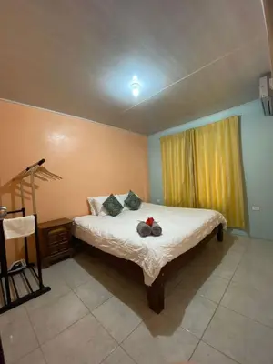 a bedroom with a bed with two stuffed animals on it at Jordi´s House in Fortuna