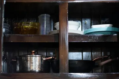 a shelf with dishes and a pot on it at Jordi´s House in Fortuna