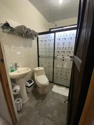 a bathroom with a toilet and a sink at Jordi´s House in Fortuna