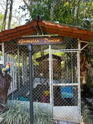 a bird cage with a sign that reads pandilla darias at Eco Villas Tambor Tucanes in Tambor