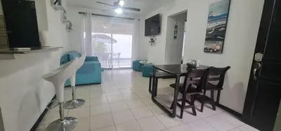 a kitchen with a table and chairs in a room at Herradura Home 2 in Herradura