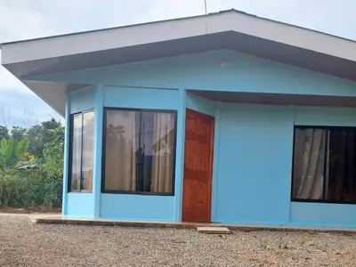 a blue house with a door and windows at Jessie's Country House Rivas in Rivas