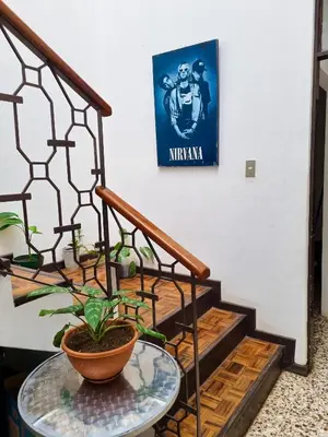 a set of stairs with a plant on a table at 714 Studios in San José