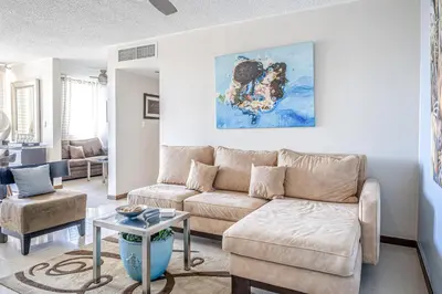 a living room with a couch and a table at Costa Linda 2-28 in Jacó