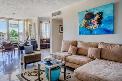 a living room with a couch and a table at Costa Linda 2-28 in Jacó