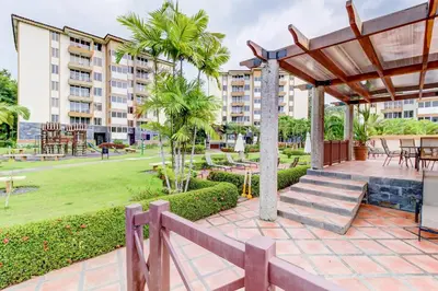 a patio with a gazebo and a park at Costa Linda 2-28 in Jacó