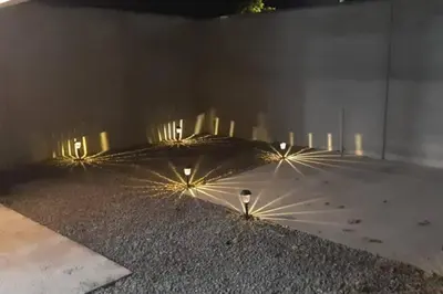 an umbrella laying on the ground with lights on it at Casa San Gerardo in Bagaces