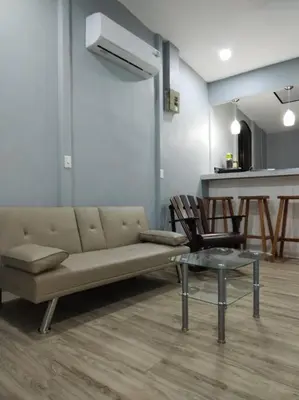 a living room with a couch and a table and chairs at Casa San Gerardo in Bagaces