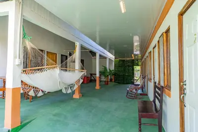 a hallway with two hammocks in a building at Hotel El Cocobolo Food&Rest Room 1 B&B WiFi AC Pkg Free Swimmingpool in Ahogados