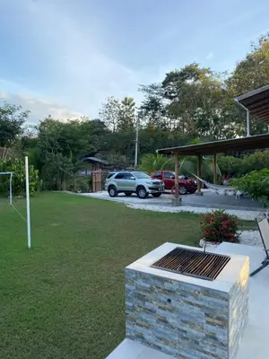 a park with a car parked in a parking lot at Casa Gratitud in Paquera