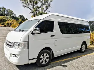 a white van parked in a parking lot at Hotel El Cocobolo Food&Rest Room 7 B&B WiFi AC Pkg Free Swimmingpool in Ahogados
