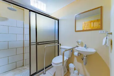 a bathroom with a toilet and a sink at Hotel El Cocobolo Food&Rest Room 7 B&B WiFi AC Pkg Free Swimmingpool in Ahogados