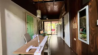 a dining room with a wooden table and chairs at Chillout House in Monteverde Costa Rica