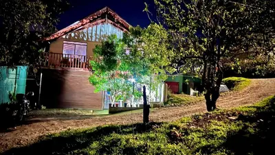 a small tree in front of a house at Chillout House in Monteverde Costa Rica