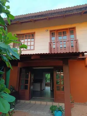 an entry to a house with a balcony at Manantial de Vida in Bejuco