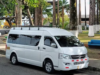 a white van parked in a parking lot at Hotel El Cocobolo Food&Rest Room 4 B&B WiFi AC Pkg Free Swimmingpool in Liberia