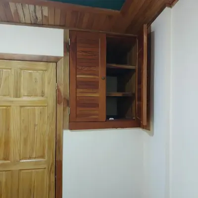 a cupboard and a door in a room at Alisson Hotel y Restaurant in Monteverde Costa Rica