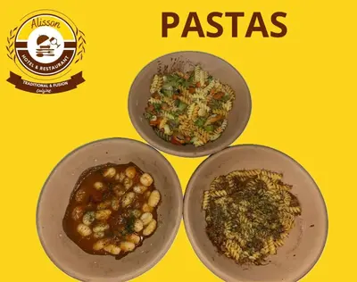 three plates of food on a yellow background at Alisson Hotel y Restaurant in Monteverde Costa Rica