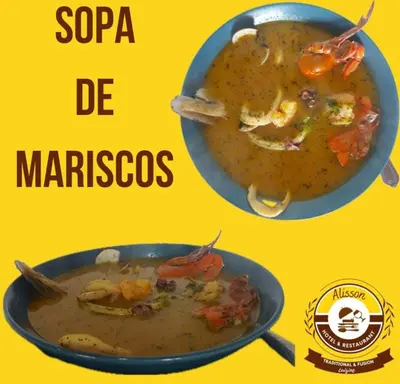 a bowl of soup on a yellow background at Alisson Hotel y Restaurant in Monteverde Costa Rica