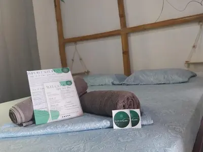 a bed with two boxes on top of it at Flor de bambú in Uvita